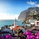 Câmara de Lobos village nesting against a rocky coastline featuring Igreja de São Sebastião with the ocean extending to the horizon